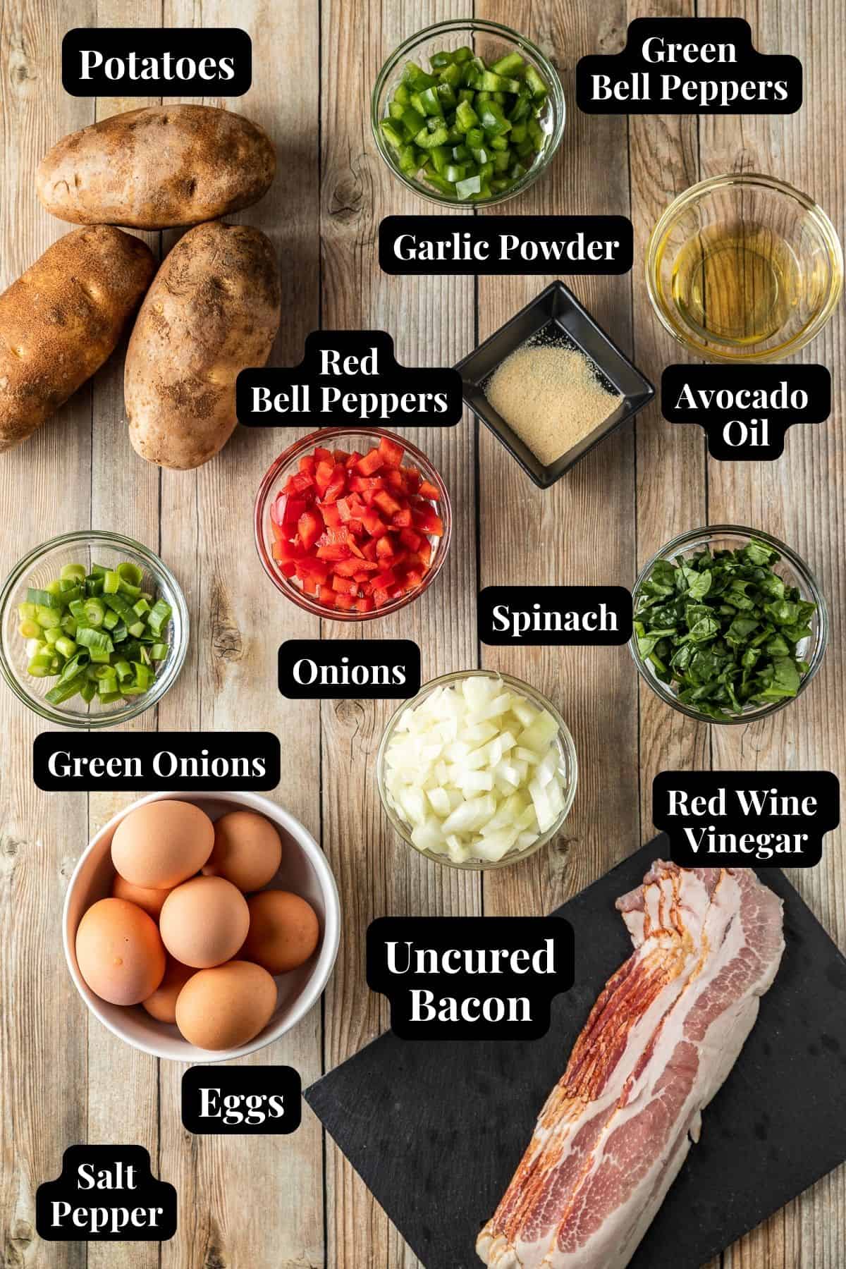 Ingredients needed for a Blackstone eggs and bacon breakfast in glass bowls on a wood background.