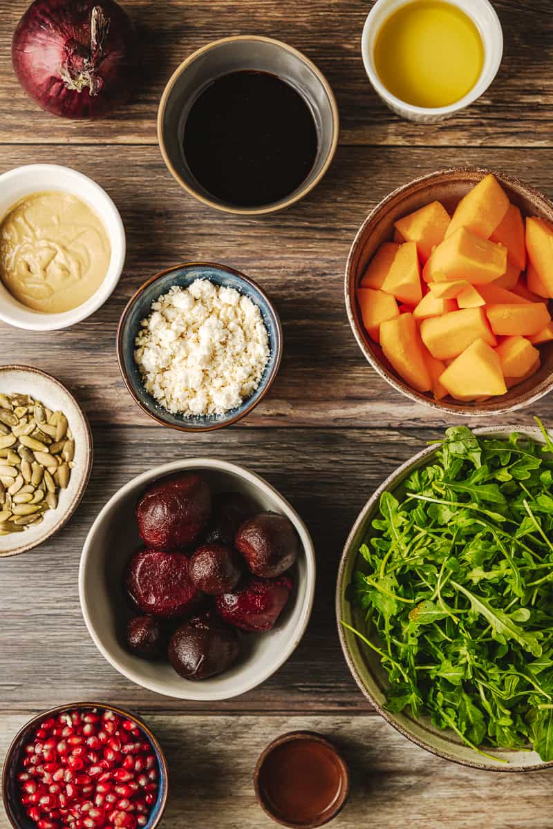 An overview shot of the ingredients needed for a butternut and beetroot salad.