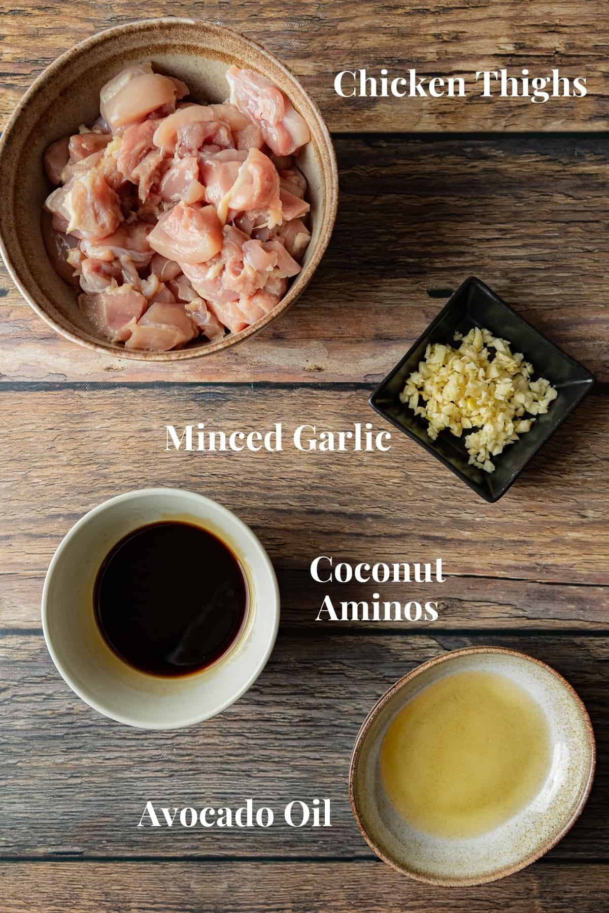 An overview shot of the ingredients needed for chicken marinade on a wood background