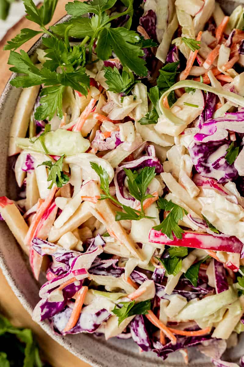 A closeup overview shot of a bowl of Whole30 coleslaw topped with parsley