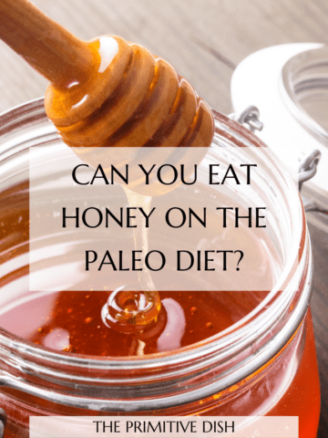 Honey drizzle into a glass jar with the text overlay "Can you eat honey on the paleo diet?"