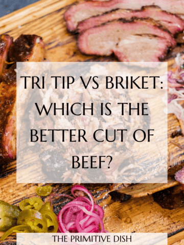 Sliced brisket on a wood cutting board near veggies with a text overlay reading tri tip vs brisket: which is the better cut of beef